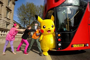 Pikachu getting onto a bus